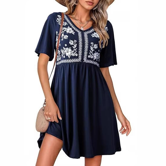 Robe décontractée pour femme à col en V, imprimée, manches courtes, taille marquée et coupe ample.